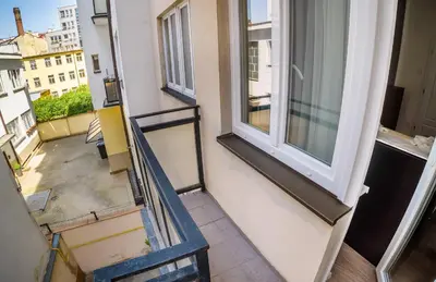 a view from the top of a balcony with a stair case at Michal&Michael’s Central Apartments in Prague