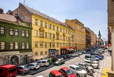 a city street filled with parked cars and buildings at Michal&Michael’s Central Apartments in Prague
