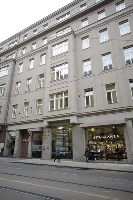 a building on a street with a person walking in front of it at Luxury apartment Spálená in Prague