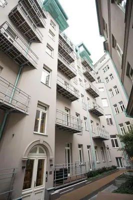 an apartment building with balconies on the side of it at Luxury apartment Spálená in Prague