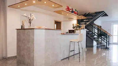 a bedroom with a bed with red balloons on the ceiling at Penzion Solid Spa in Mladá Boleslav