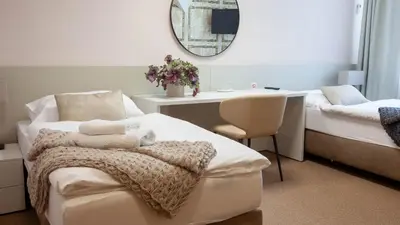 a bathroom with a counter with a sink and a mirror at Penzion Solid Spa in Mladá Boleslav
