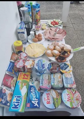 a table filled with lots of different types of food at Homestay Svatá in Svatá