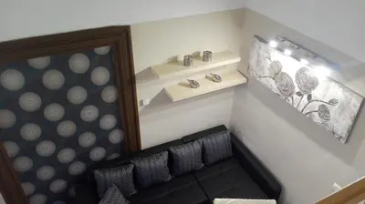 a room with chairs and plates on a wall at Jilská 449/14 in Prague