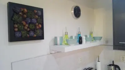 a bathroom with a painting of fruit on the wall at Jilská 449/14 in Prague