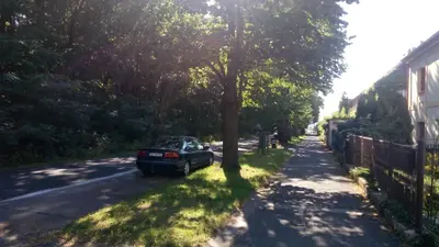 a car parked on the side of a street at Atmospheric Quiet Apartment in Prague