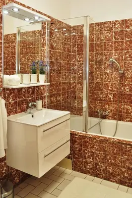 a bathroom with a sink and a shower at Atmospheric Quiet Apartment in Prague