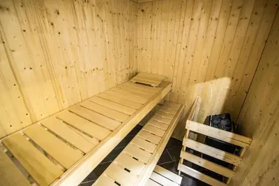a wooden sauna with two bunk beds in it at Brooklyn Sauna Apt by Ruterra in Prague