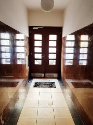 an empty room with a door and a tiled floor at Stylish apartment a few steps from metro in Prague