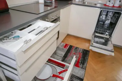 a kitchen with a white sink and a counter at Stylish apartment a few steps from metro in Prague
