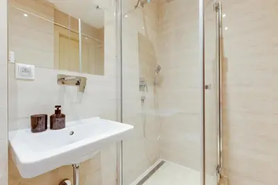 a bathroom with a sink and a shower at Modern Quiet Apt next to Wenceslas Square - VS in Prague