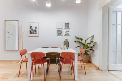 a white dining room with a white table and chairs at Modern Quiet Apt next to Wenceslas Square - VS in Prague