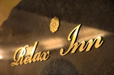 a close up of the words talle tripper next to the words failure hit at Relax Inn in Prague