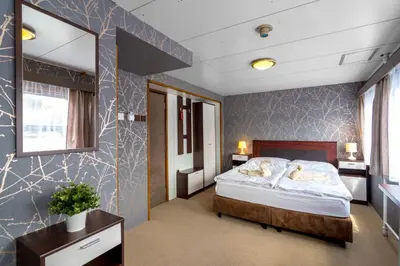 a bedroom with a bed and a mirror at Botel Vodnik in Prague