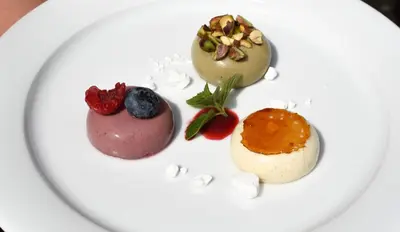 three different types of desserts on a white plate at Savoia Castle in Škvorec