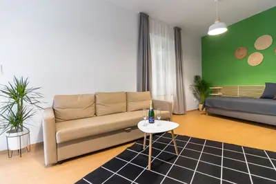 a living room with a couch and a table at Hotel Museum in Prague