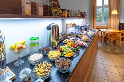 a buffet of food on a counter in a kitchen at Hotel Museum in Prague