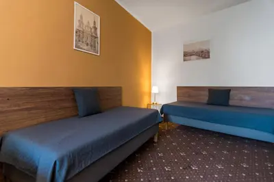 a hotel room with two beds in a room at Hotel Museum in Prague