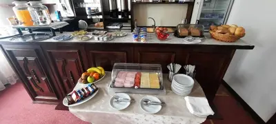 a kitchen with a table with food on it at Hotel Excellent in Prague