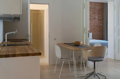 a kitchen with a table and chairs in a room at Stay in heart of town in Prague