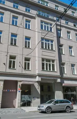 a silver car parked in front of a building at Stay in heart of town in Prague