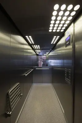 a subway hallway with a row of lights on the ceiling at Stylish apartment in old town Prague in Prague