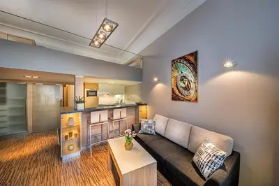 a living room with a couch and a table at Stylish apartment in old town Prague in Prague