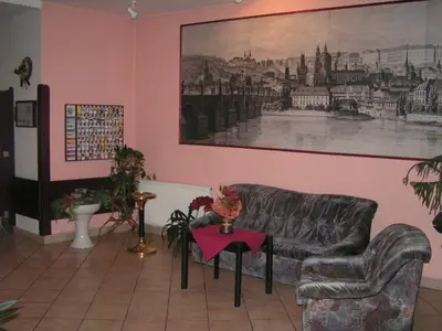 a living room with a couch and a table at Hotel Jerabek in Prague