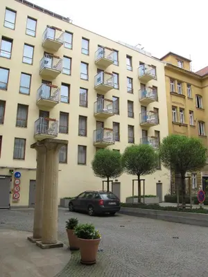 a car parked in front of a large building at Aparthotel Austria Suites in Prague