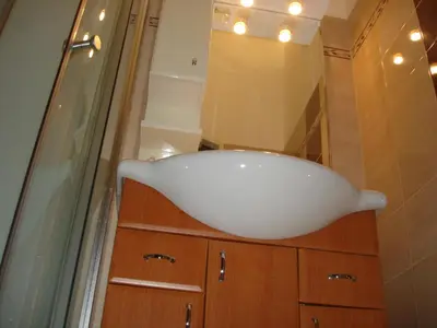 a bathroom with a white sink and a mirror at Pension Easy Journey in Prague