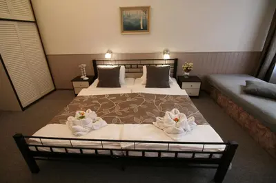 a bedroom with two beds with flowers on them at Anette Hotel in Prague