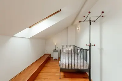 a dining room with a glass table and purple chairs at Apartments Almandine in Prague