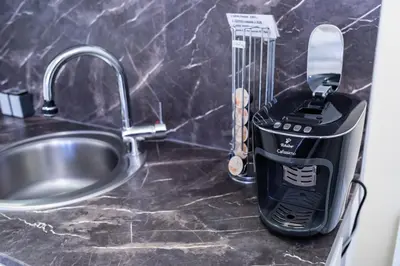 a hair drier on a counter next to a sink at Studio near Congress Centre II. in Prague