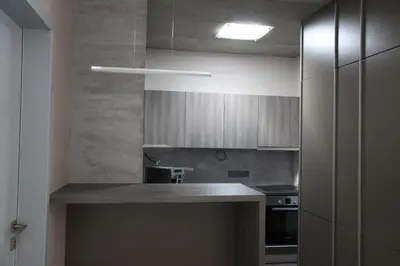 a kitchen with a counter top and a stove at Blue House Relax in Velké Popovice