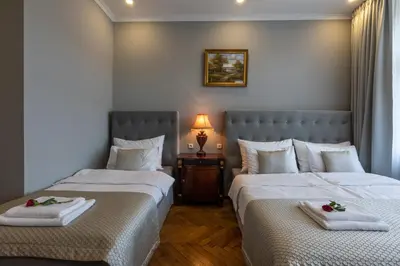 two beds sitting next to each other in a room at SlaBur Residence in Prague