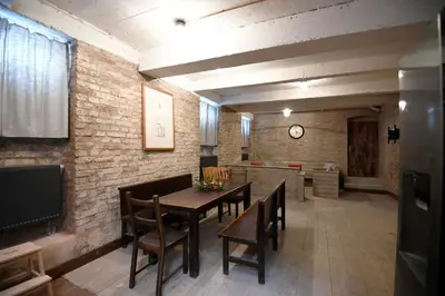 a dining room with a table and chairs at Giotto Apartments in Prague