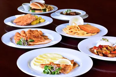 a group of plates of food on a table at Apartmány & Kemp Sázavský ostrov in Sázava