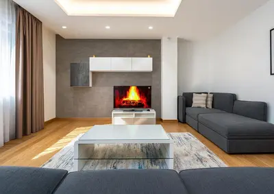 a living room with a couch and a fireplace at Wishlist Prague Residences - Old Town Dlouha in Prague