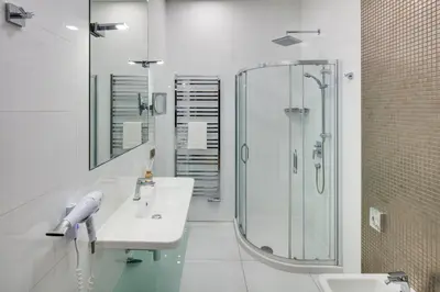 a hotel room with two beds and a couch at Wenceslas Hotel & Apartments in Prague
