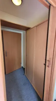 an empty room with two large wooden doors at Pension Patanka in Prague