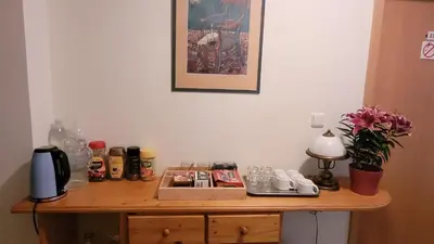 a wooden table with items on top of it at Pension Patanka in Prague