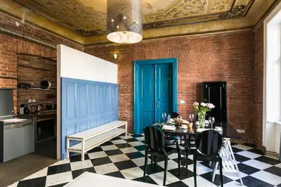 a bedroom with a bed and a television in it at Old Town - Dusni Apartments in Prague
