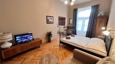 a balcony with a table and chairs in a building at Old Town - Dusni Apartments in Prague