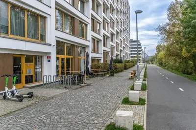 an empty street in front of a building at Wishlist Prague Residences - Karlín FREE PARKING in Prague