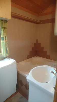 a bathroom with a tub and a white sink at Na vyhlidce in Litoměřice