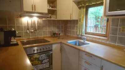 a kitchen with a sink and a stove and a window at Na vyhlidce in Litoměřice
