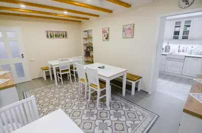 a kitchen and dining room with a table and chairs at Guesthouse SaM in Roudnice nad Labem