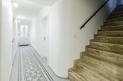 a hallway with stairs and a tile floor at Guesthouse SaM in Roudnice nad Labem