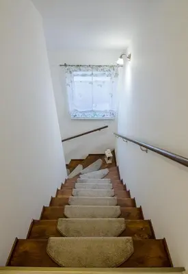a staircase in a house with a window at Guesthouse SaM in Roudnice nad Labem