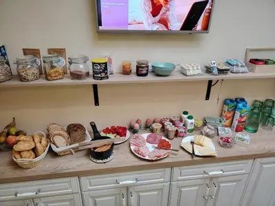 a counter with many different types of food on it at Guesthouse SaM in Roudnice nad Labem